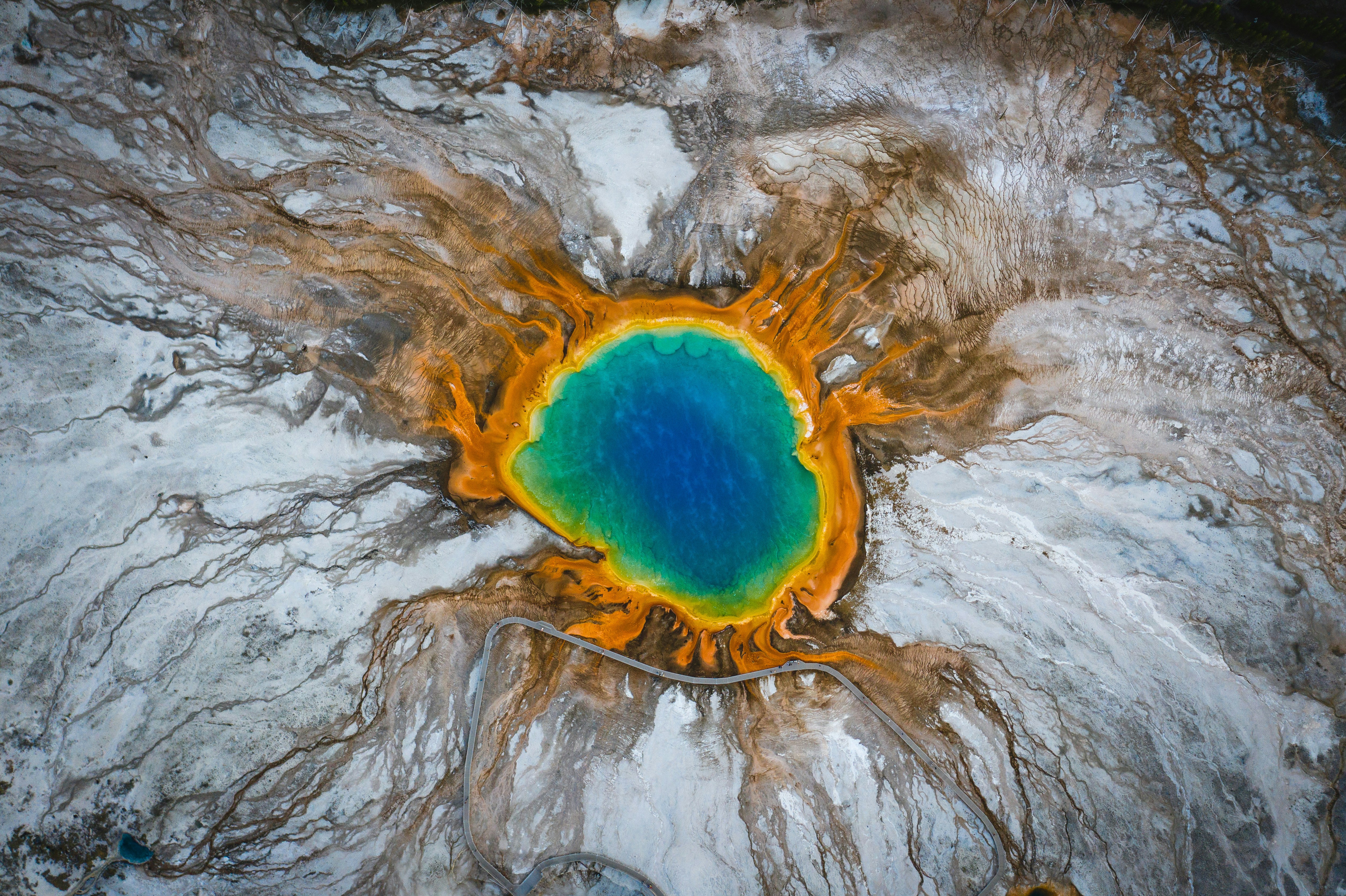 Aerial view of Yellowstone thermal pools and snowy mineral terraces