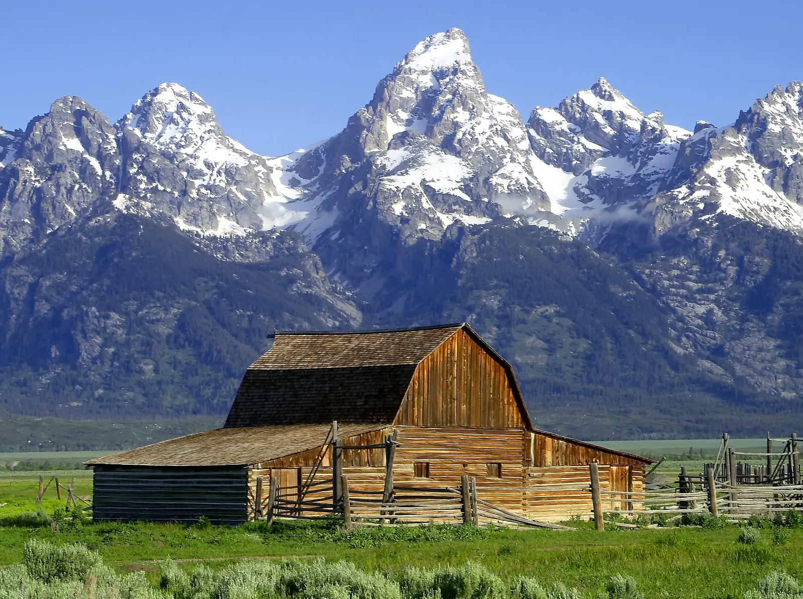 Jackson Hole summer group trip for men, Mormon Row barn below the Tetons