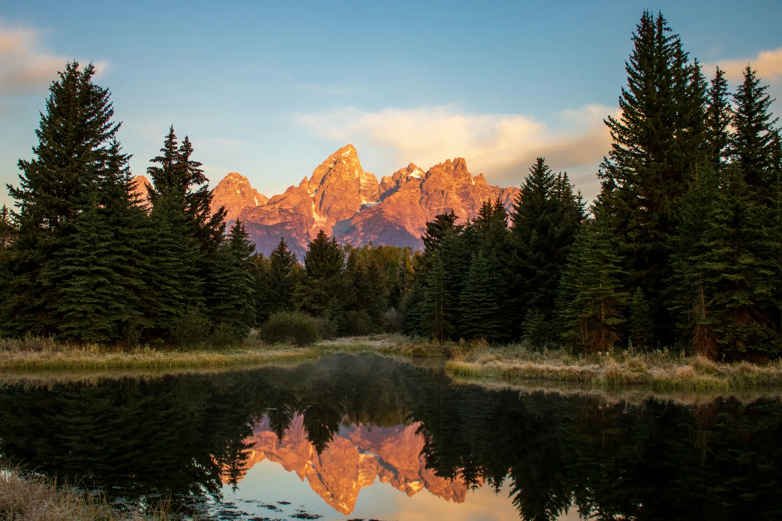Jackson Hole autumn group trip for men, Teton range reflected at sunrise