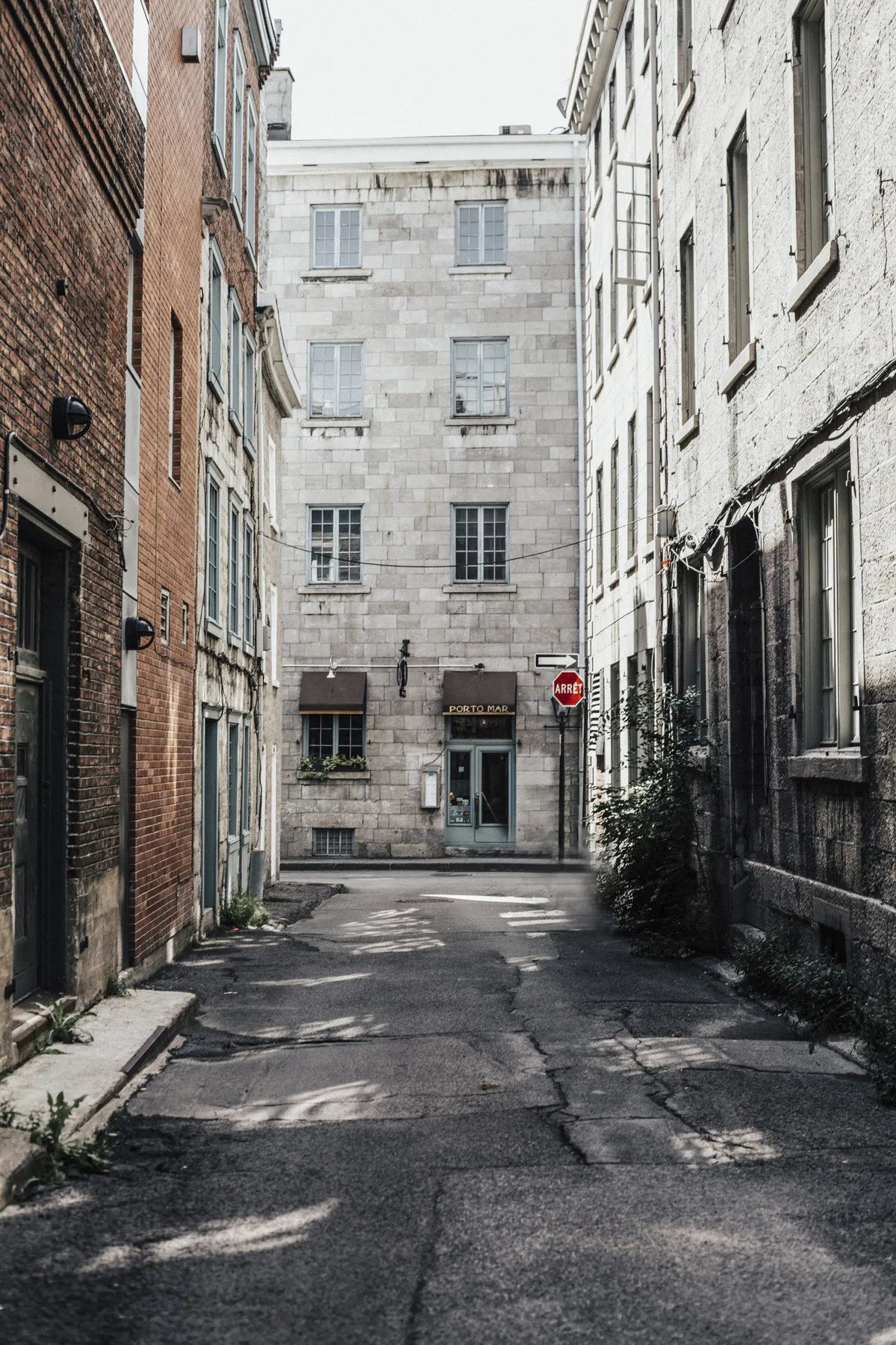 Quiet stone-lined street outside Le Petit Hôtel Notre Dame in Old Montreal